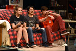 theater cast, 3 sitting on couch playing video games