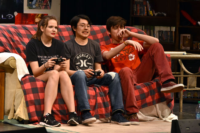 theater cast, 3 sitting on couch playing video games